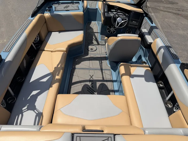 Slide: The Image of Interior view of a 2021 ATX 22 Type-S boat with beige and gray seating. - 20