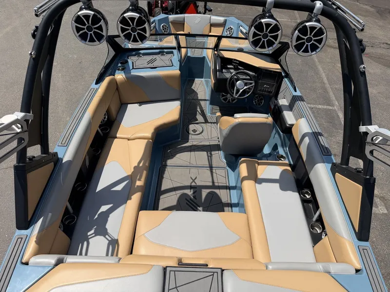 Slide: The Image of Interior view of a 2021 ATX 22 Type-S boat with modern seating and speakers. - 24