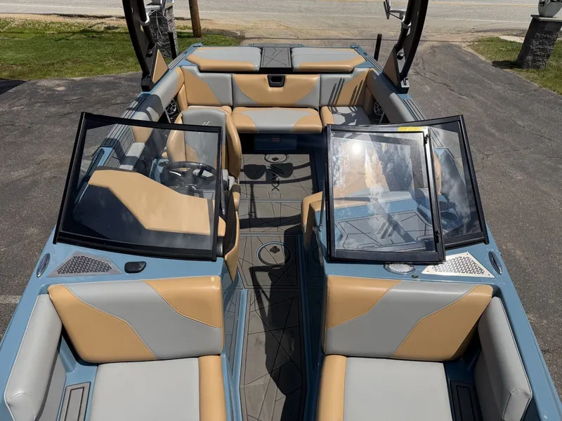 Slide: The Image of Interior view of a 2021 ATX 22 Type-S boat with beige and gray seating. - 18