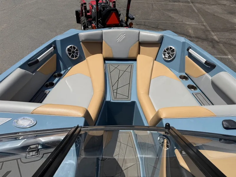Slide: The Image of The image shows the interior of a 2021 ATX 22 Type-S boat with beige and gray seating. - 21