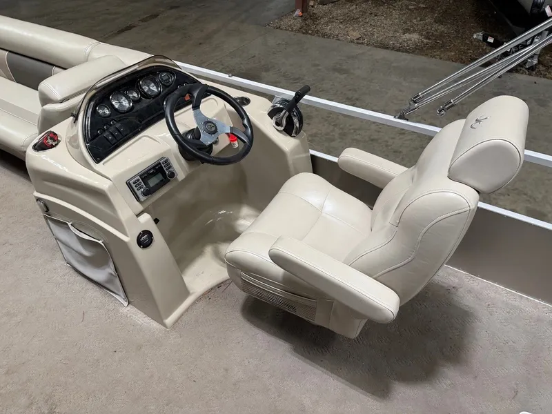 Slide: The Image of The image shows a boat cockpit with a beige captain's chair and a steering console. - 21