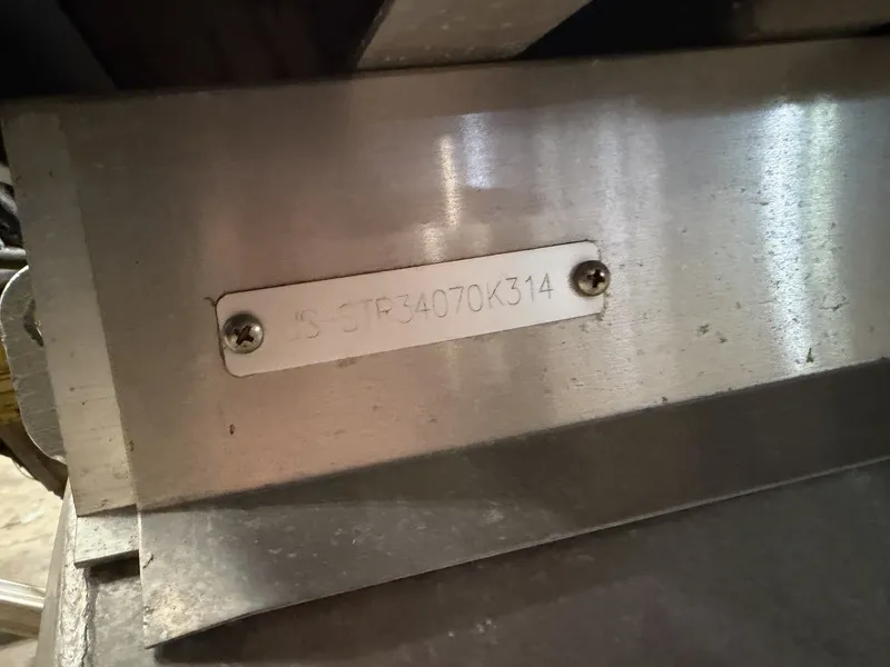 Slide: The Image of Close-up of a metal plate with a serial number on a boat. - 7