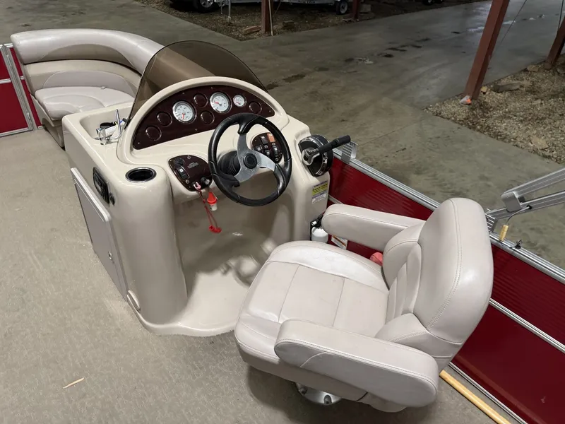 Slide: The Image of Interior view of a Starcraft boat with steering wheel and seat. - 14