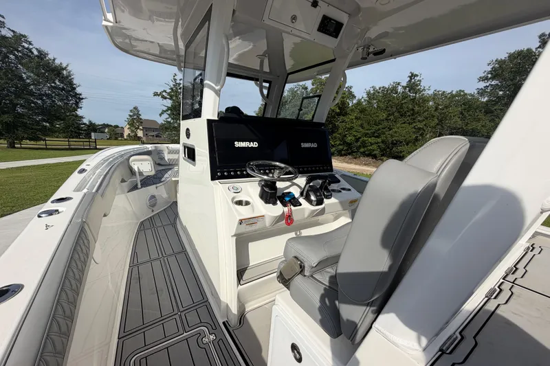 Slide: The Image of 2024 Sea Pro 322 Offshore boat interior with advanced navigation system and sleek design. - 15