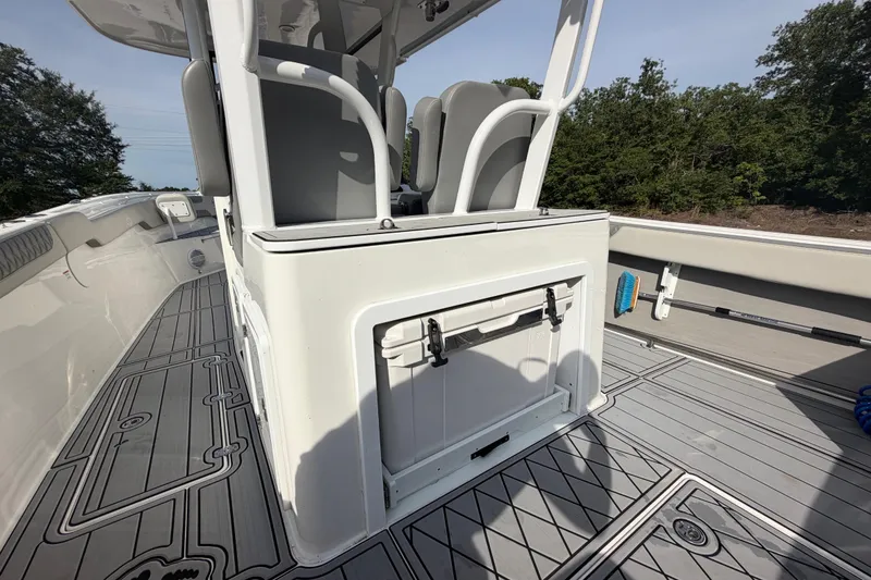Slide: The Image of 2024 Sea Pro 322 Offshore boat interior with seating and storage, featuring sleek design and spacious deck. - 13