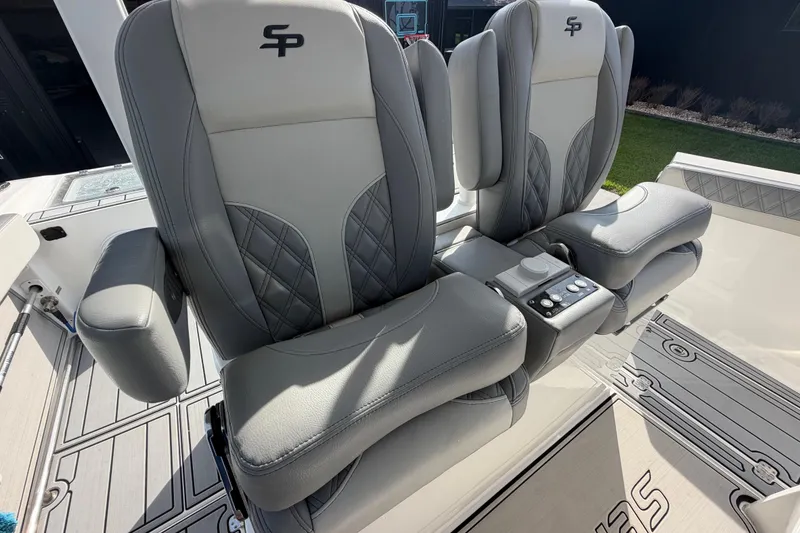 Slide: The Image of Luxurious seating on 2024 Sea Pro 322 Offshore boat, featuring plush gray upholstery. - 12