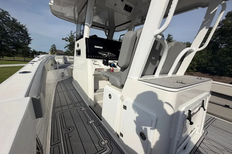 Slide: The Image of 2024 Sea Pro 322 Offshore boat interior with advanced navigation system and seating. - 19