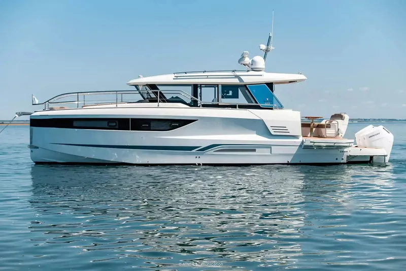 The Image of A modern Wellcraft 44 Explorer boat on calm water under a blue sky. - 1