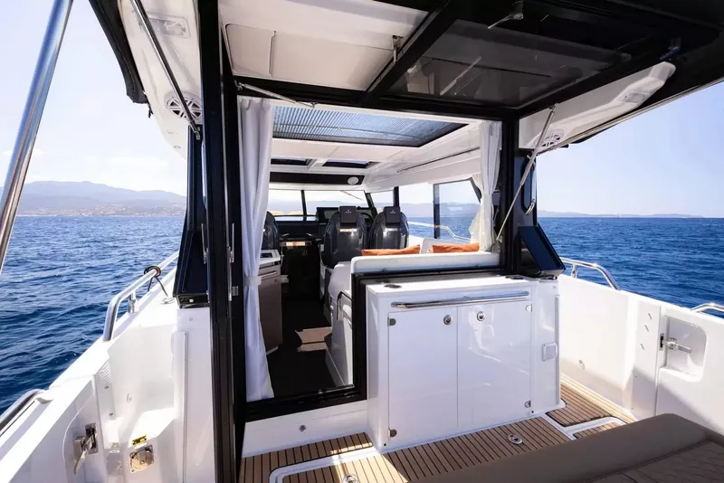 Slide: The Image of The image shows the interior of a Wellcraft 38 Explorer, situated on the water. - 4
