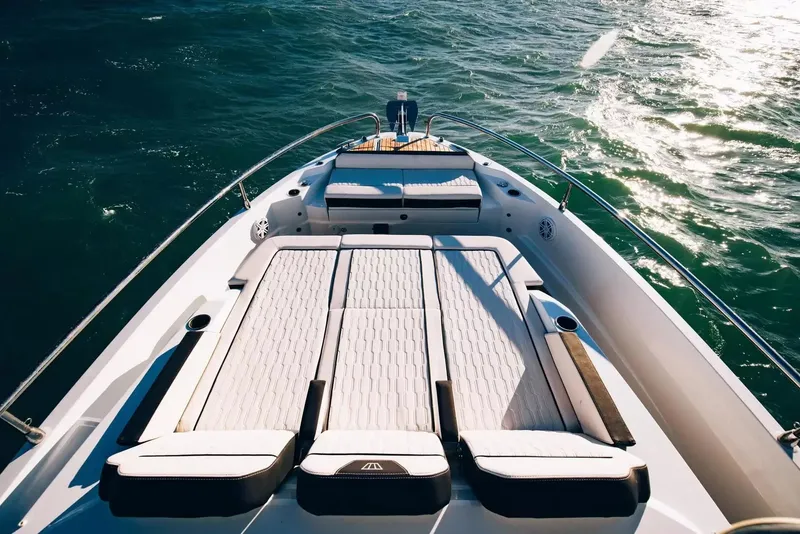 Slide: The Image of The image shows the deck of a Wellcraft 38 Explorer boat on the water. - 14