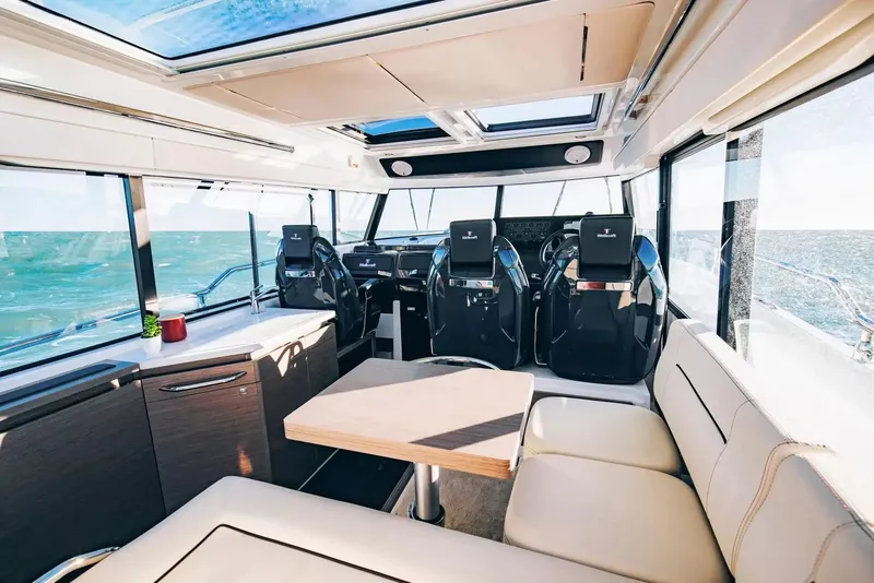 Slide: The Image of Interior of a modern yacht with panoramic windows and stylish seating. - 12