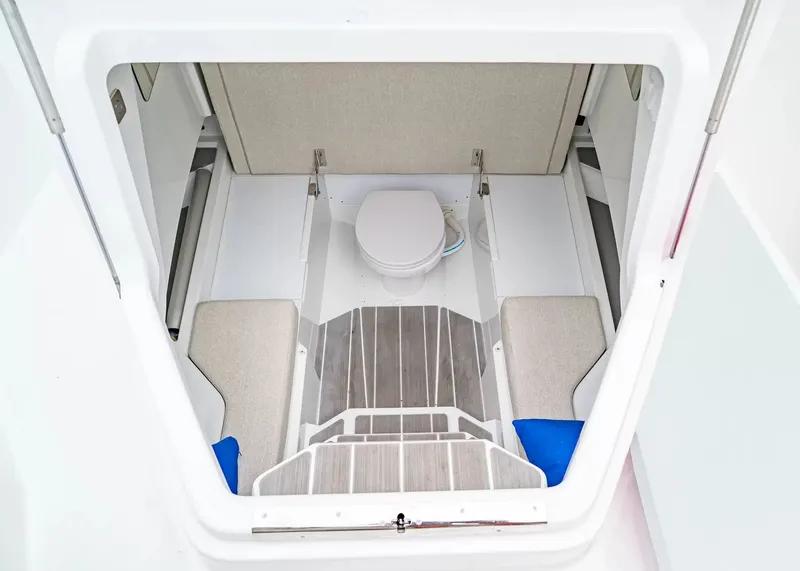 Slide: The Image of Interior view of a modern boat cabin with a toilet and seating area. - 27
