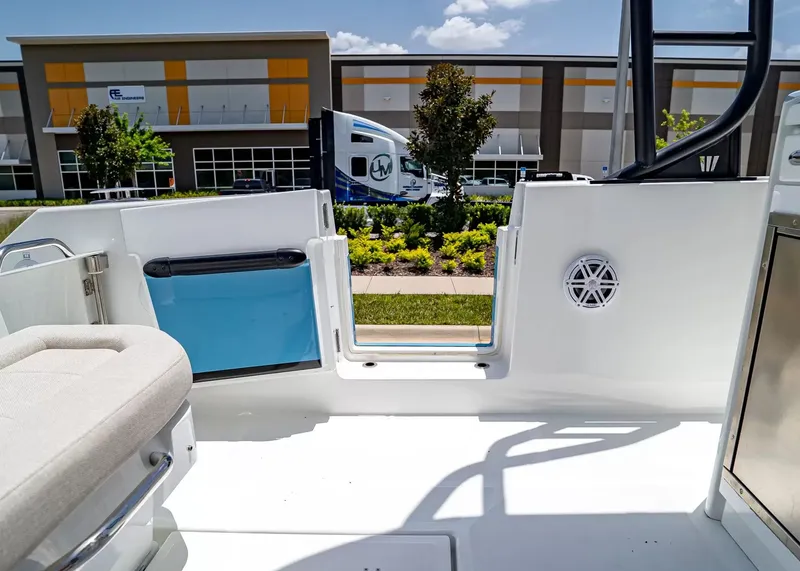 Slide: The Image of The image shows the cockpit of a 2027 Wellcraft 28 T-Top boat. It features a modern design. - 13