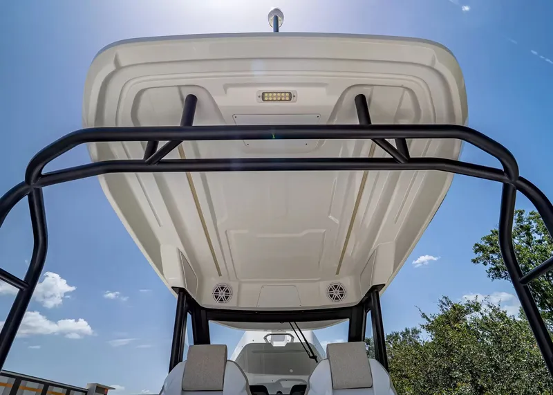 Slide: The Image of The image shows the T-Top of a 2027 Wellcraft 28 boat with speakers and lighting. - 21