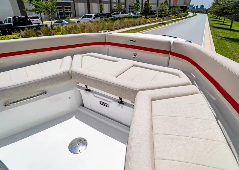 Slide: The Image of The 2027 Wellcraft 28 T-Top features a spacious, cushioned seating area at the bow. - 32