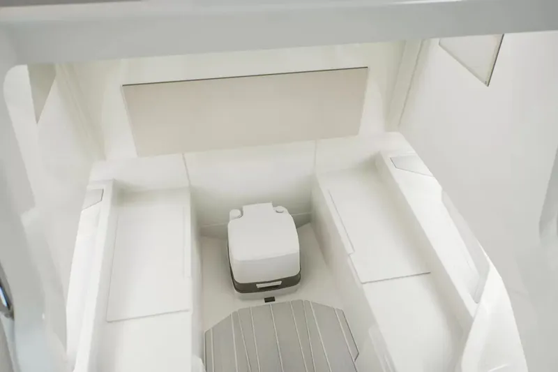 Slide: The Image of Interior of the 2027 Wellcraft 28 Explorer with two benches and a portable toilet. - 16