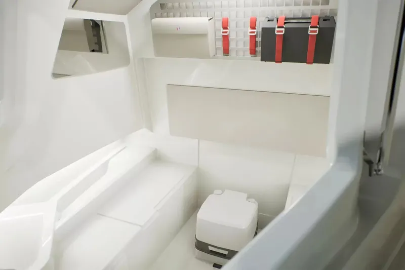 Slide: The Image of Interior of the Wellcraft 28 Explorer featuring storage and a toilet. - 17