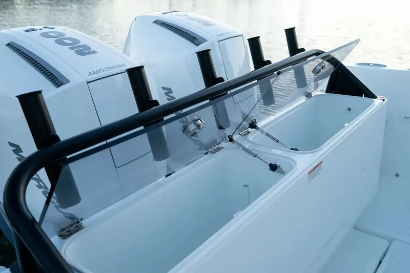 Slide: The Image of The image shows the stern area of a Wellcraft 28 Explorer with two Mercury outboard engines. - 7