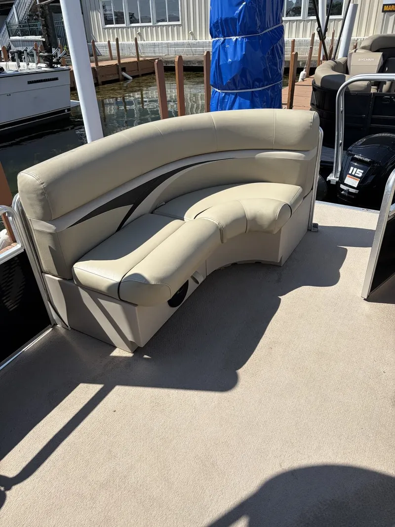 Slide: The Image of A cream-colored seating sofa on a boat, with an engine in the background. - 6
