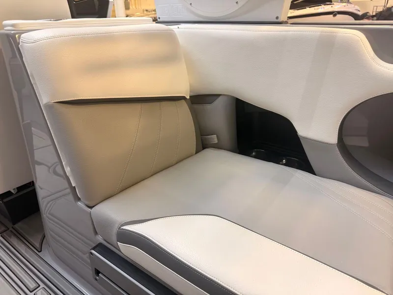 Slide: The Image of The image shows a sleek, upholstered seat in a modern boat. - 13