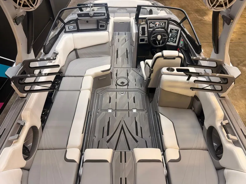 Slide: The Image of Interior view of a modern boat with gray and white seating, helm, and speakers. - 6