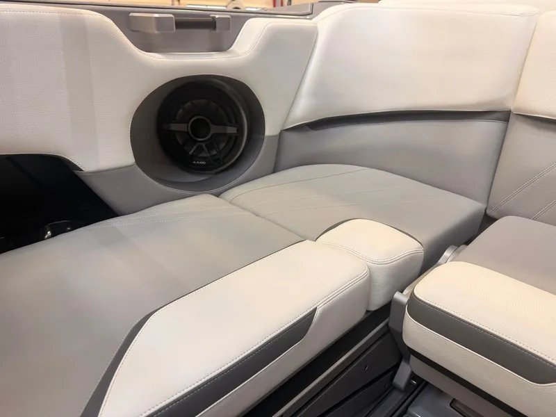 Slide: The Image of The image shows a boat interior with gray and white upholstery. - 11