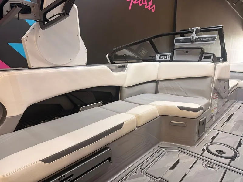Slide: The Image of The image shows the interior of a modern boat with sleek, light-colored seating and a stylish dashboard. - 10