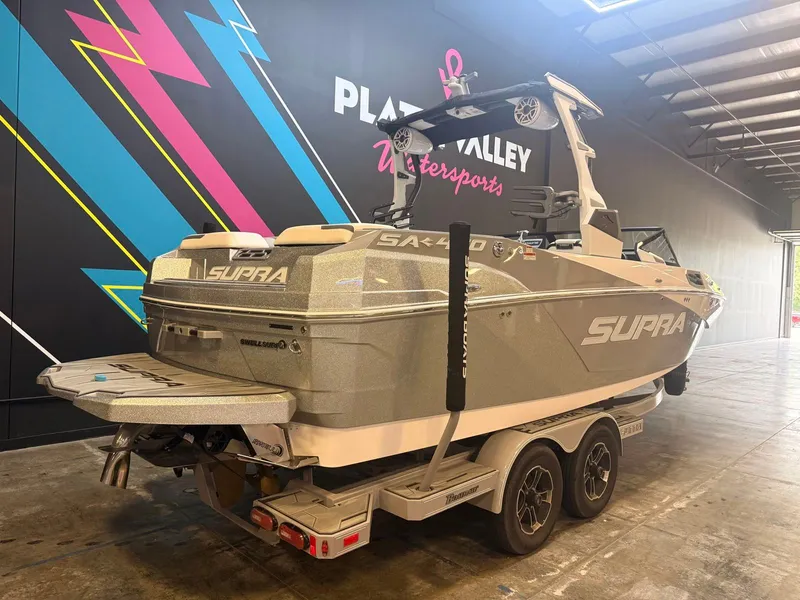 Slide: The Image of A 2022 Supra SA boat is on a trailer inside a warehouse. - 3