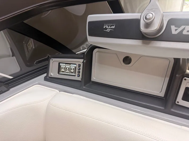Slide: The Image of Interior view of a 2022 Supra SA with controls and white seating. - 14
