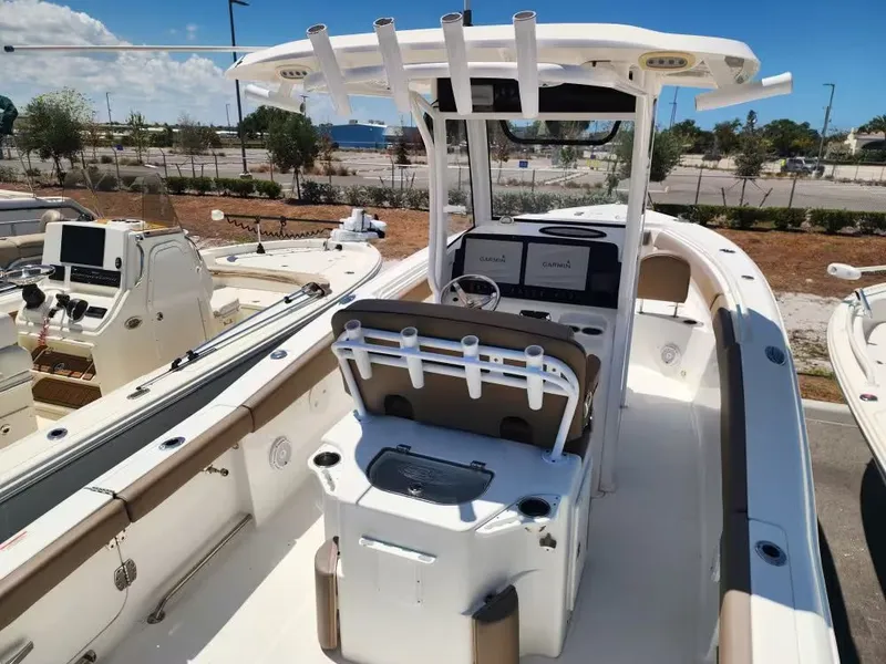 Slide: The Image of A 2021 Sea Hunt Ultra 265 SE with a spacious cockpit and modern helm console. - 7