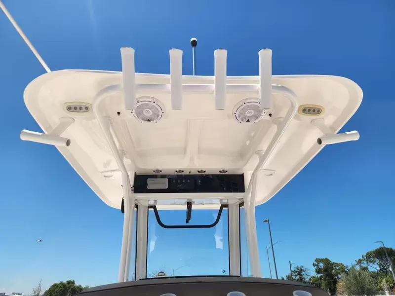 Slide: The Image of View of a Sea Hunt Ultra 265 SE boat's T-top with fishing rod holders. - 11