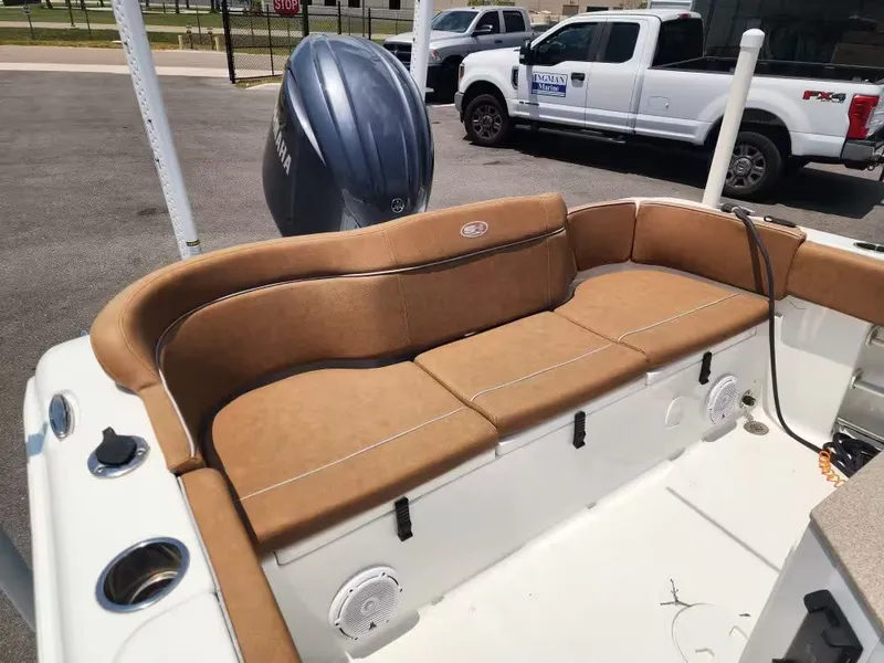 Slide: The Image of The image shows the seating area of a 2024 Sea Hunt Ultra 234 boat. - 7