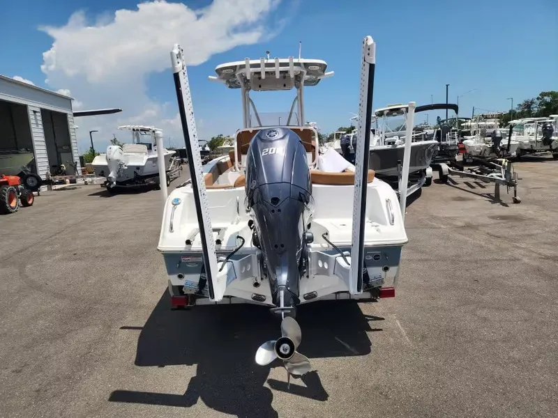 Slide: The Image of The image shows a 2024 Sea Hunt Ultra 234 boat with an outboard motor. - 6