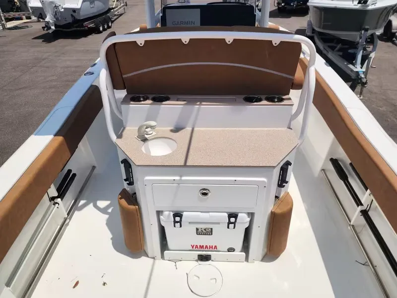 Slide: The Image of The image shows the cockpit of a Sea Hunt Ultra 234 boat with a Yamaha cooler. - 9
