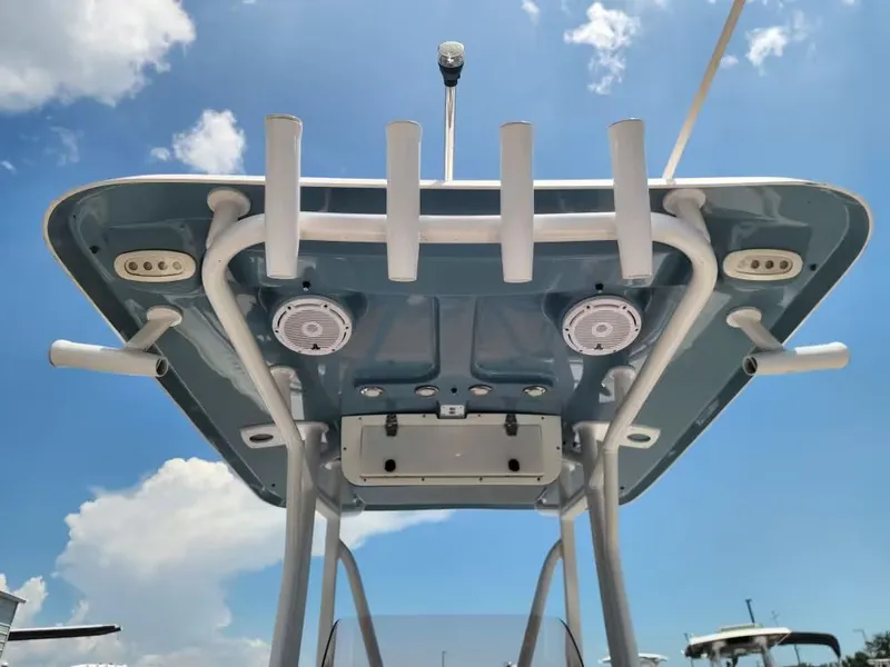Slide: The Image of View of a Sea Hunt Ultra 234 boat's T-top under a blue sky. - 12