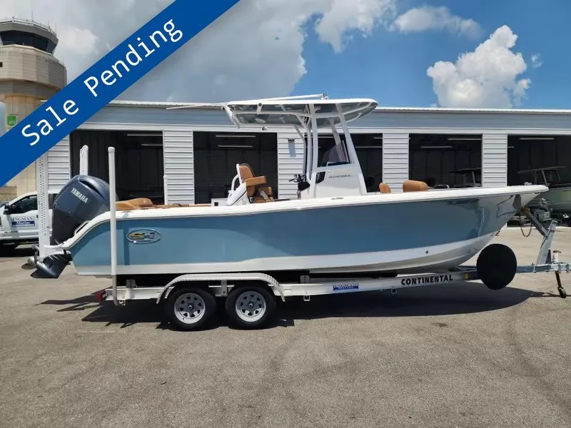 The Image of A 2024 Sea Hunt Ultra 234 boat on a trailer, with a "Sale Pending" banner. - 1