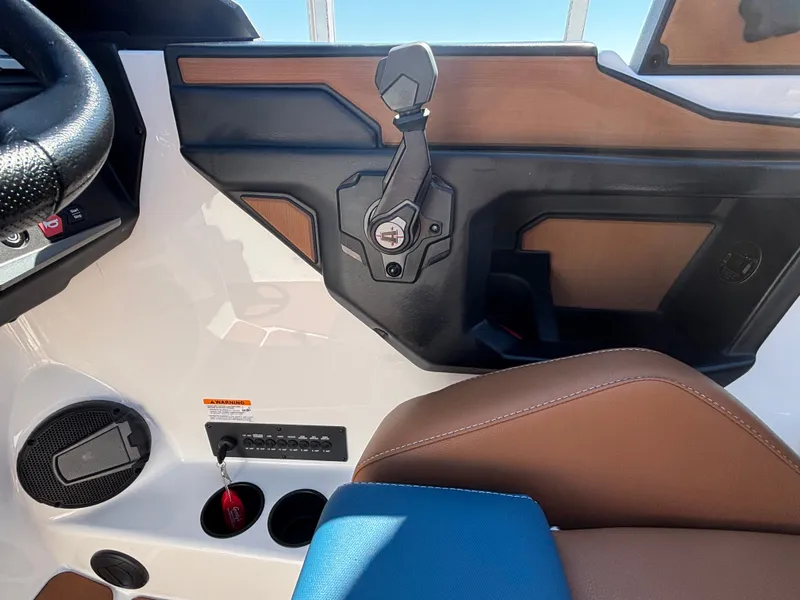 Slide: The Image of The image shows the cockpit of an Axis A225 boat with modern controls and stylish design. - 944