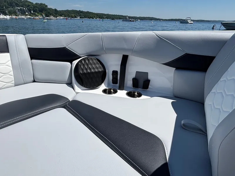 Slide: The Image of The image shows the luxurious interior of a Malibu Wakesetter 23 LSV with stylish seating. - 883