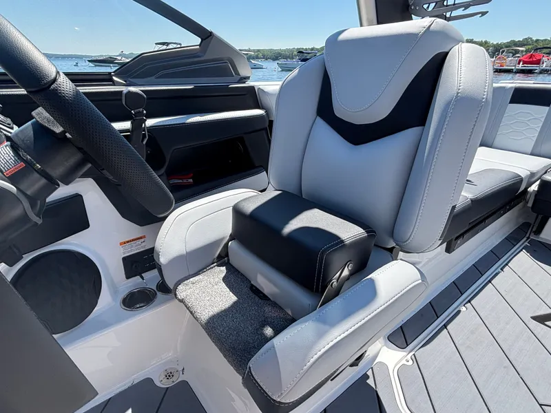 Slide: The Image of The interior of a 2026 Malibu Wakesetter 23 LSV with modern, cushioned seating. - 891