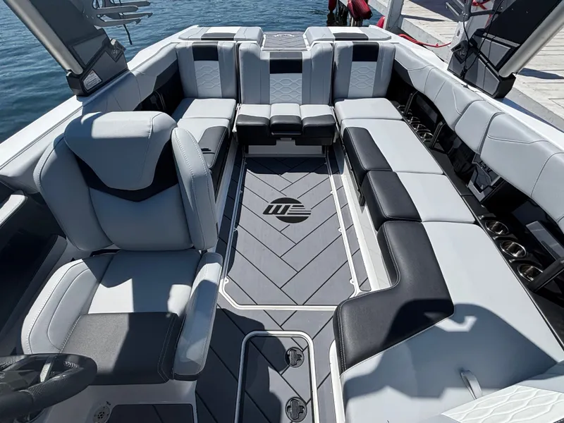 Slide: The Image of The image shows the luxurious interior of a Malibu Wakesetter 23 LSV with stylish seating. - 893