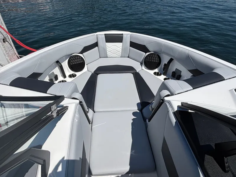 Slide: The Image of The image shows the bow area of a 2026 Malibu Wakesetter 23 LSV with gray upholstery. - 880