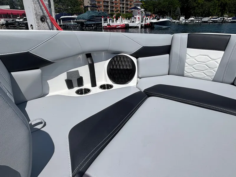 Slide: The Image of The image shows the luxurious interior of a Malibu Wakesetter 23 LSV with stylish seating. - 881