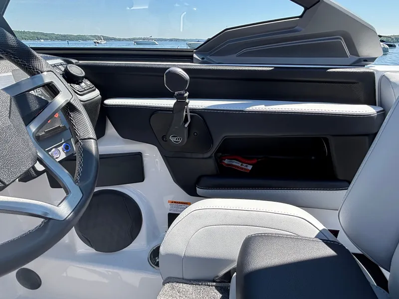 Slide: The Image of The image shows the cockpit of a 2026 Malibu Wakesetter 23 LSV with modern controls. - 890
