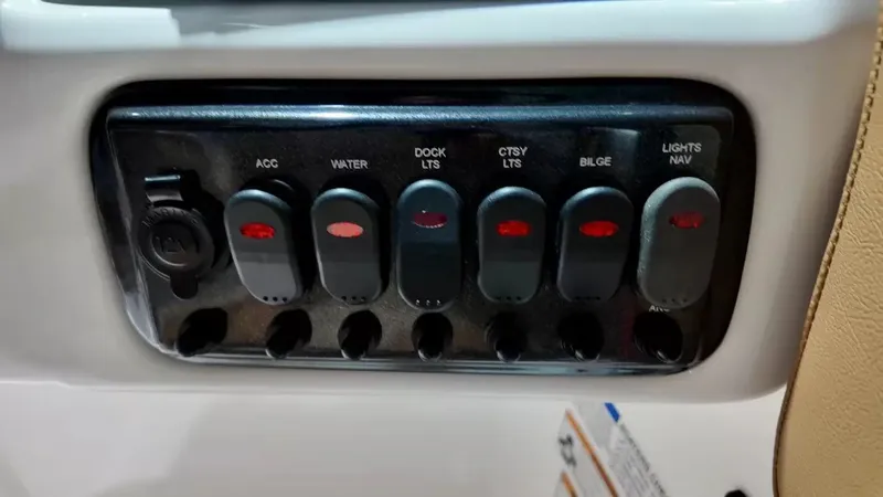 Slide: The Image of A switch panel with six toggle switches for various boat lights and functions. - 41