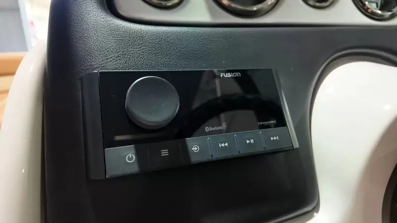 Slide: The Image of The image shows a Fusion audio system on a boat, integrated into a dashboard. - 36