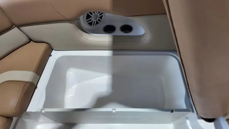 Slide: The Image of The image shows part of a boat's interior with beige upholstery and a built-in speaker. - 27