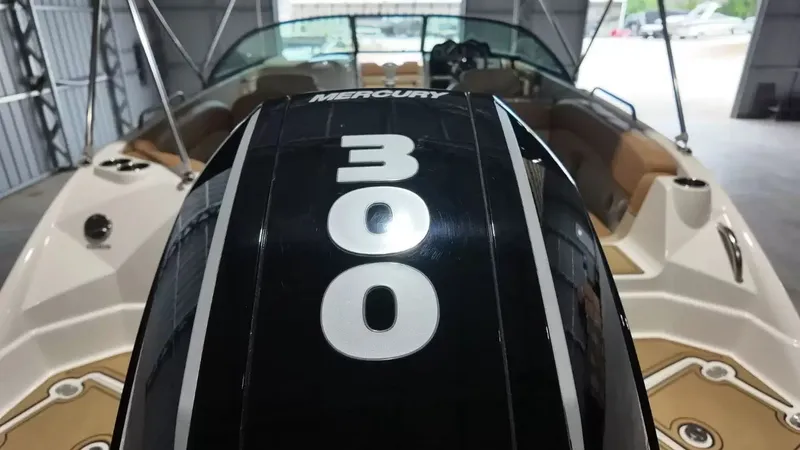 Slide: The Image of A Mercury 300 outboard motor is mounted on a NauticStar 243 DC boat inside a warehouse. - 7