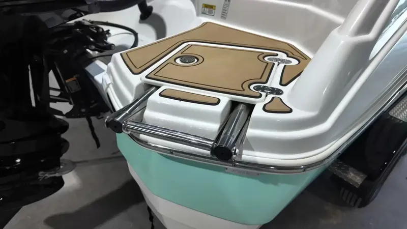 Slide: The Image of The swim platform of a NauticStar 243 DC with a retractable ladder and non-slip surface. - 4