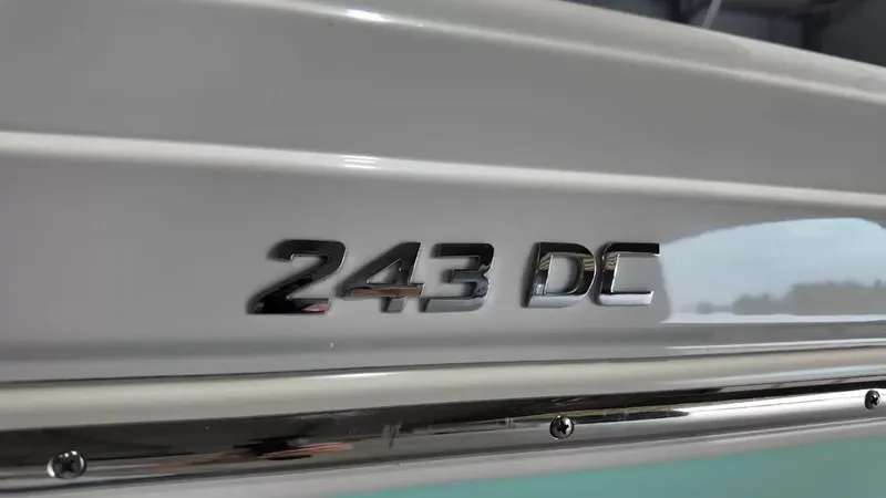 Slide: The Image of Close-up of the "243 DC" lettering on a NauticStar boat. - 11