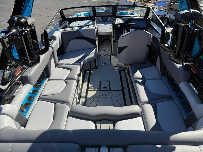 Slide: The Image of Interior view of a modern boat with gray upholstery and blue accents. - 16